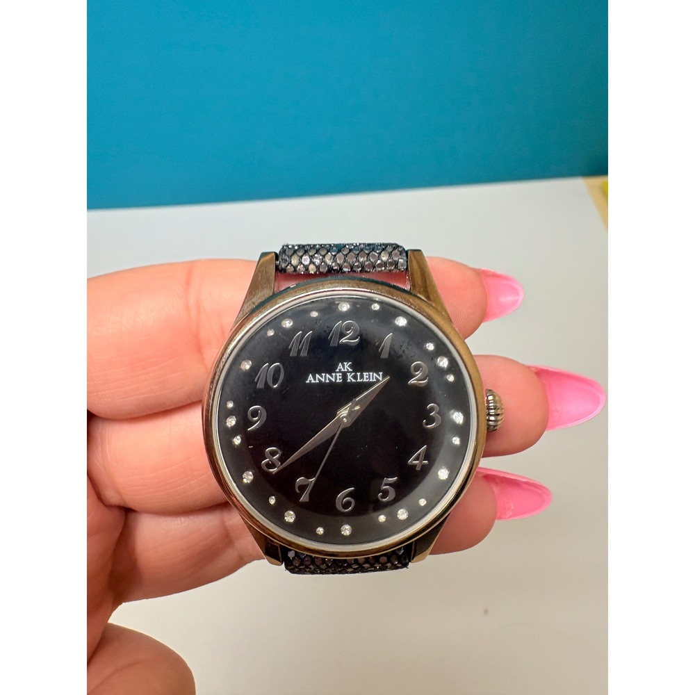 Anne Klein Womens Watch Y121E Black Dial Crystal Markers Metallic Scale Strap‎